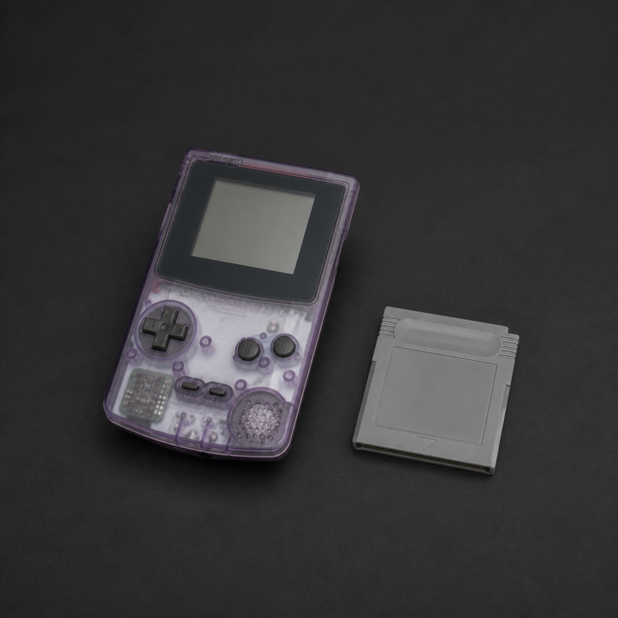 Game Boy Color — Atomic Purple, sample second-hand stock photograph